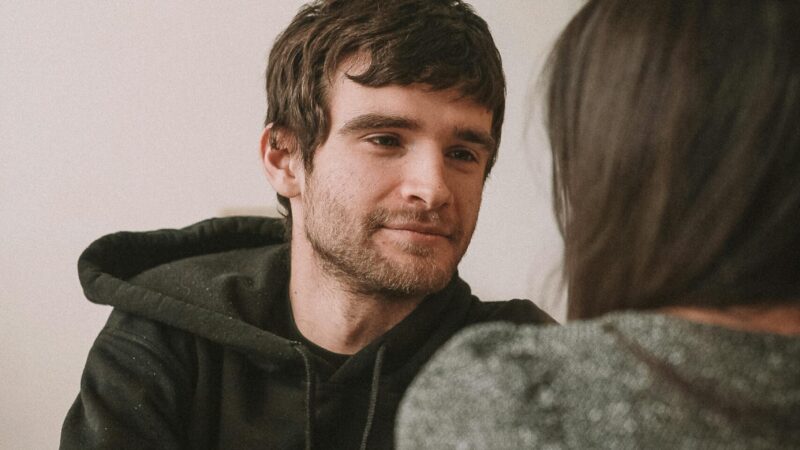 person hoodie talking