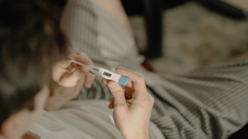 test temperature fever sitting thermometer