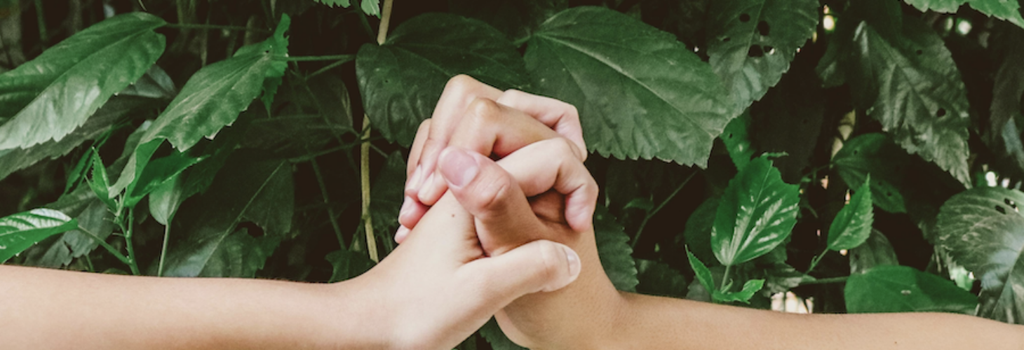 Two people holding hands